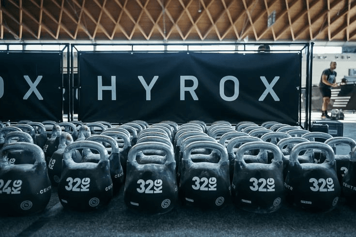 HYROX kettlebells lined up for functional fitness training